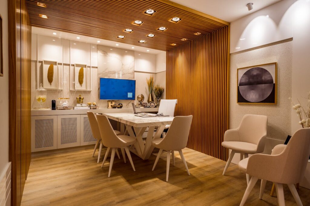 Stylish modern dining room showcasing luxurious interior design with warm wooden accents.